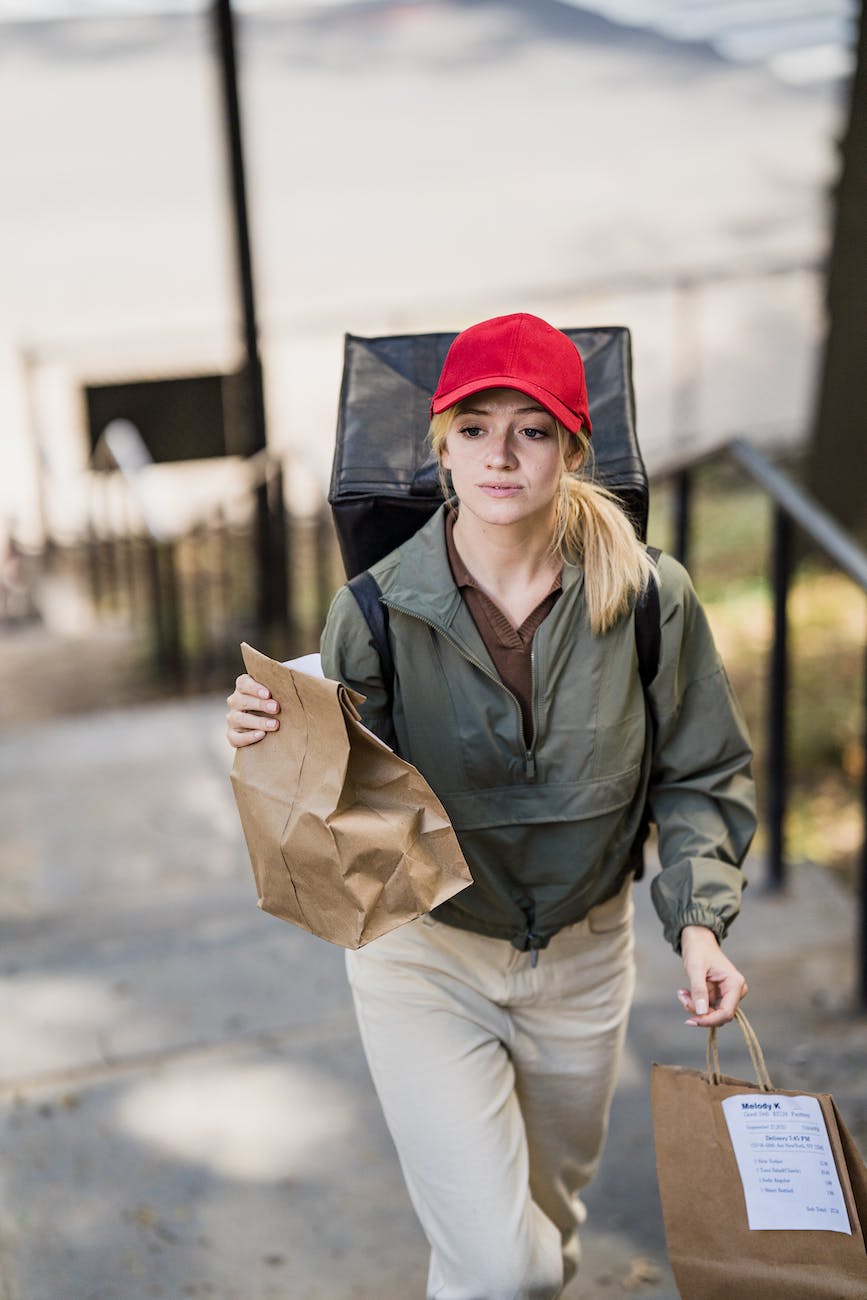 woman with paper bags and backpack