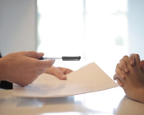 crop businessman giving contract to woman to sign