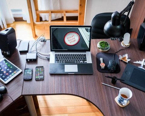 black and white laptop computer on brown wooden desk