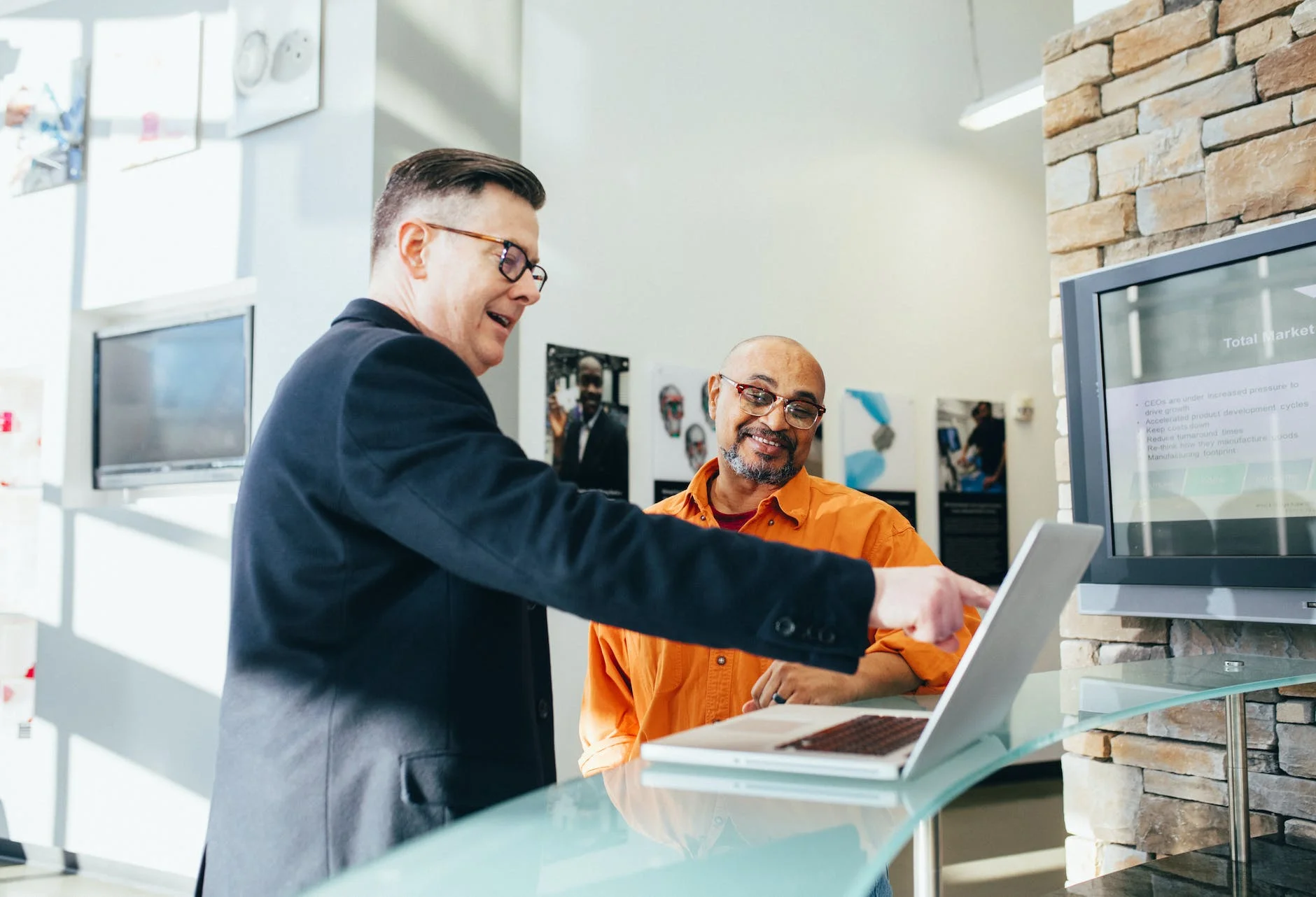 man pointing laptop computer