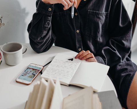 person sitting on wooden chair