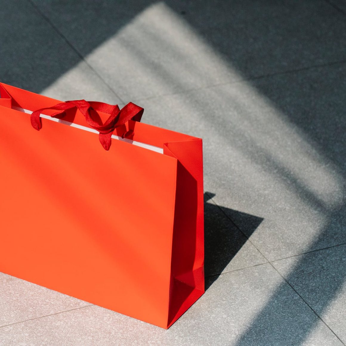 red paper shopping bag on gray ground