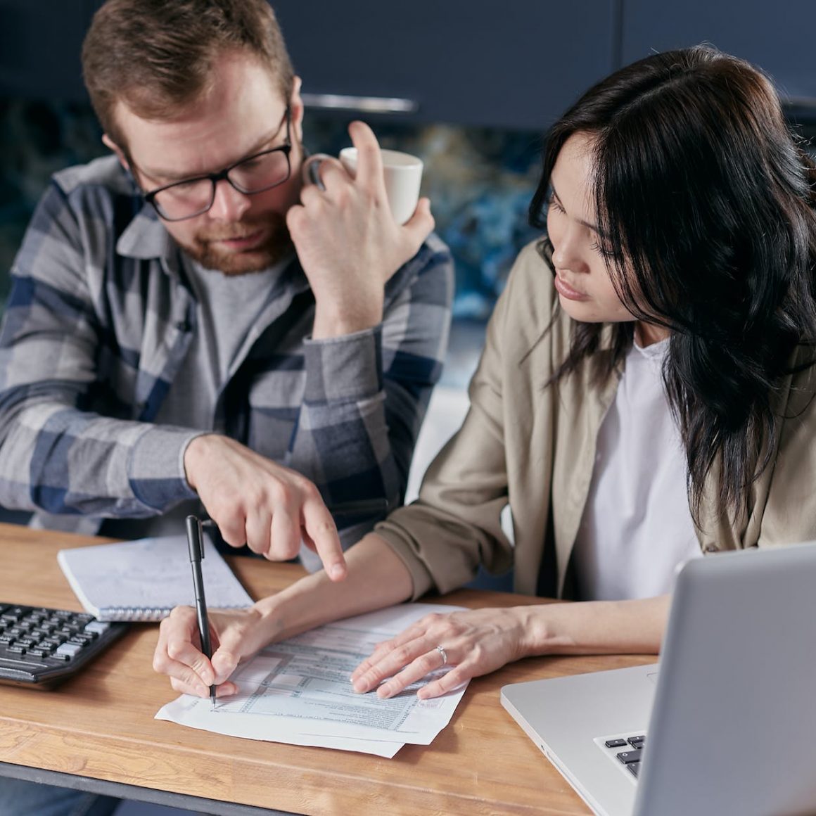 couple calculating all their bills