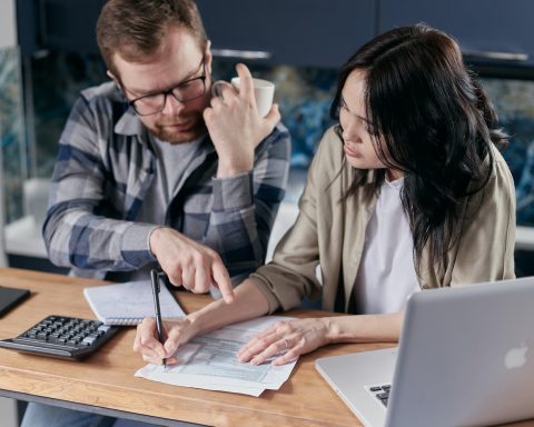 couple calculating all their bills